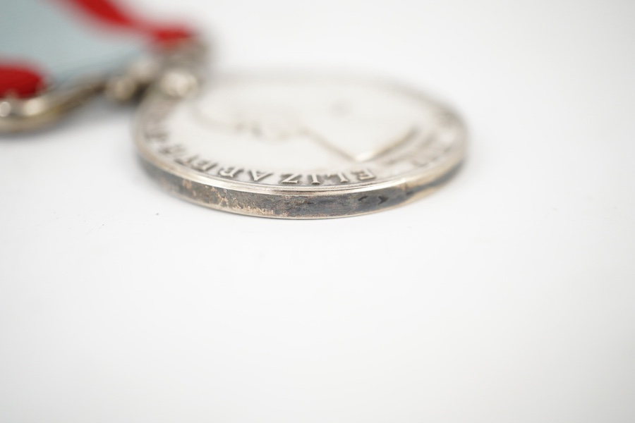 A cased ERII The Coastguard Auxiliary Service Long Service medal, awarded to Eric W. Stephens. Condition - good.